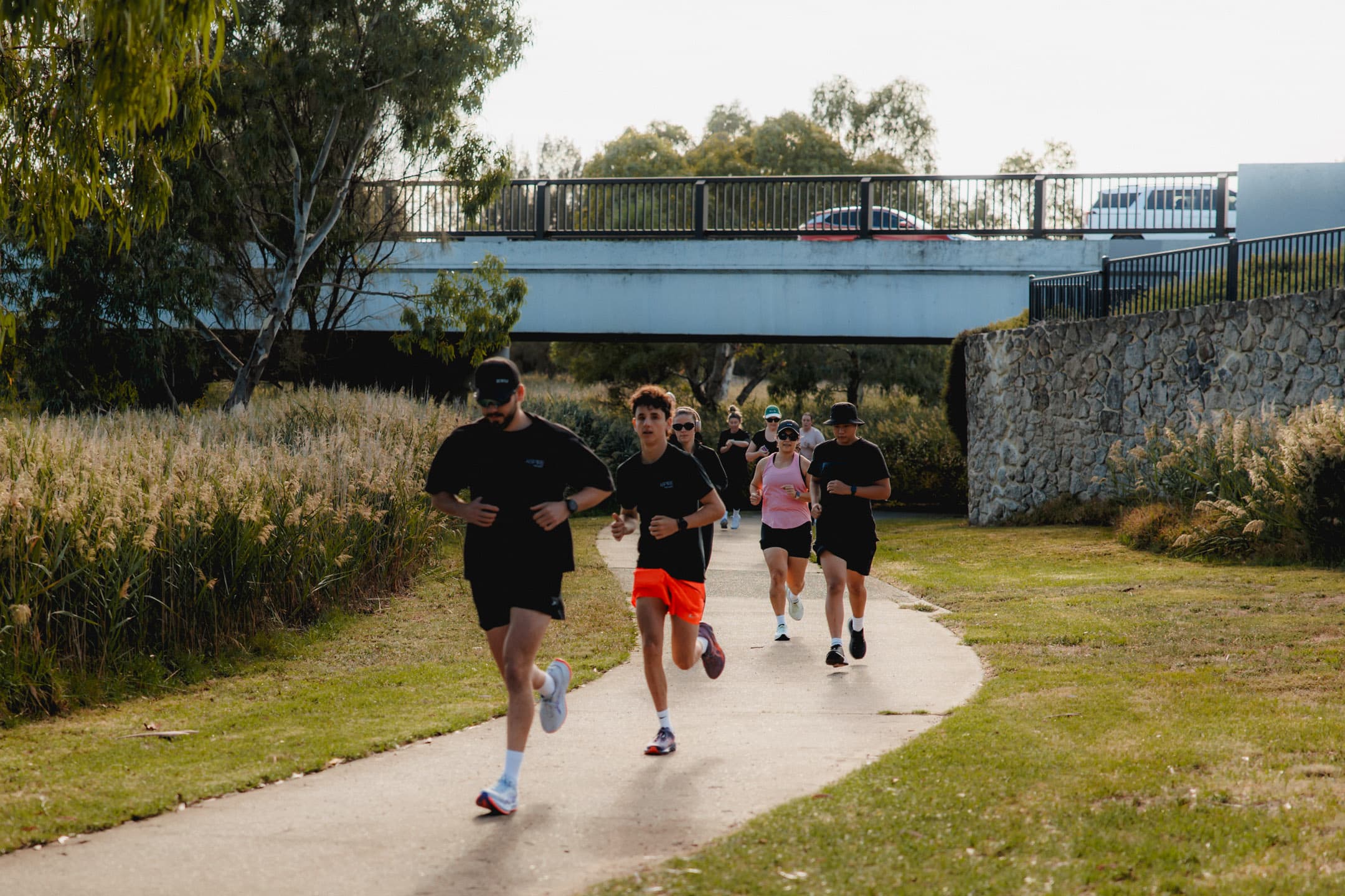 WHR crew on a candid mid-run, group laughing on the path